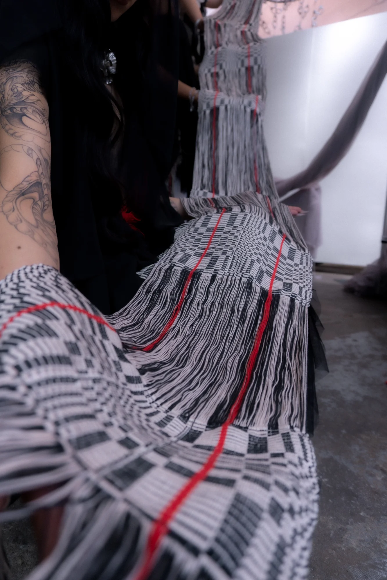Close-up of woven strands draped over a shoulder
