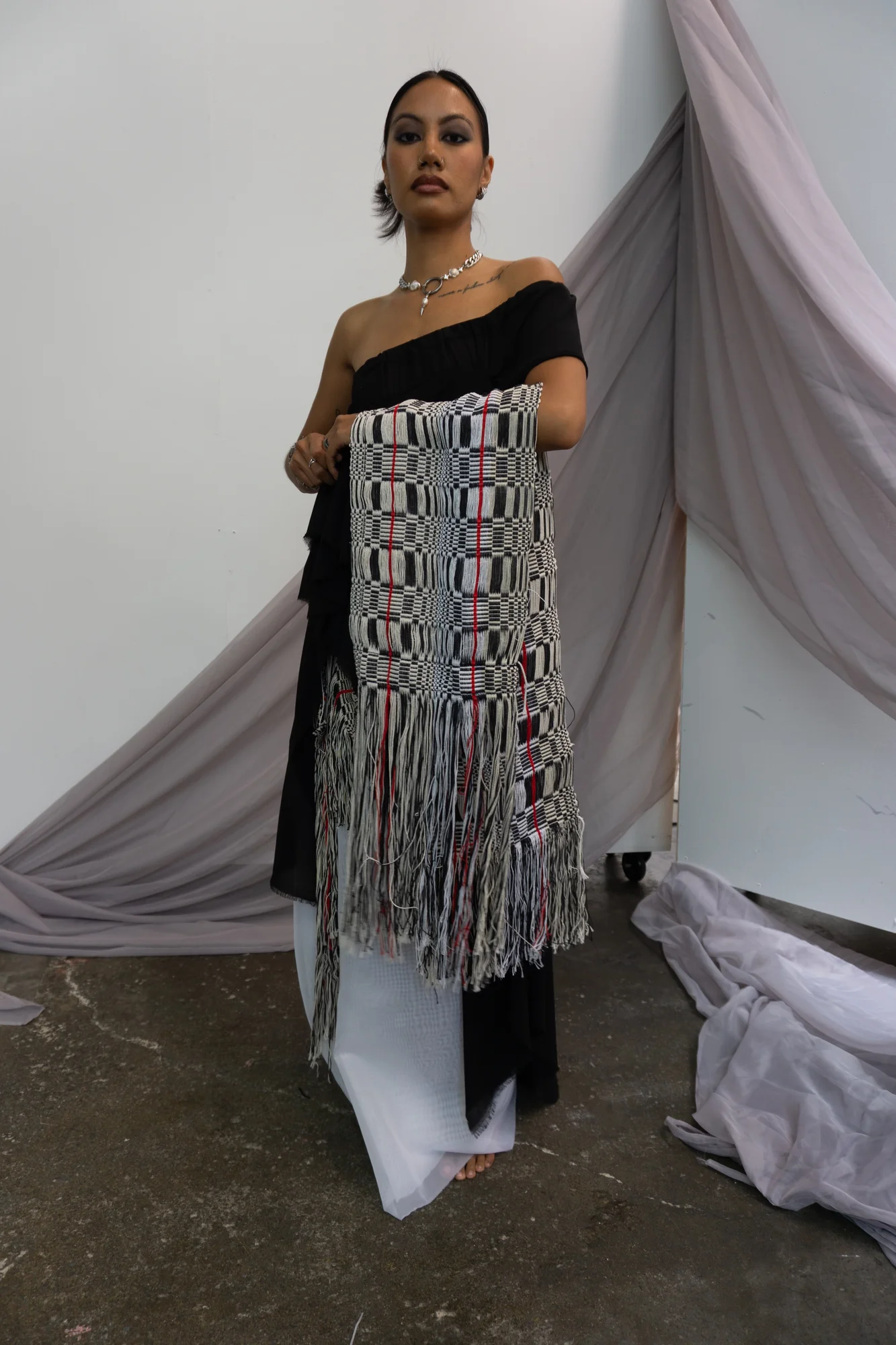 Black column silhouette with a long woven front panel